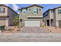 Charming two-story home with neutral paint, a two-car garage and minimal landscaping at 9086 Nostrand Ave, Las Vegas, NV 89148