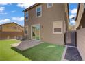 Enclosed backyard featuring a small patch of artificial turf at 9190 Wine Cellar Ave, Las Vegas, NV 89148