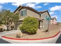 Street corner view of a well-manicured two-story home with neutral colors at 9190 Wine Cellar Ave, Las Vegas, NV 89148