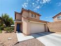 Charming two-story home has a well-maintained yard and convenient attached two-car garage at 11117 Okeefe Ct, Las Vegas, NV 89144