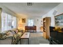 Bright and cozy living room with lots of light and comfortable furnishings at 136 Elm St, Henderson, NV 89015