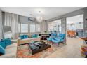 Open living room with stylish decor, neutral walls, and plush seating at 1413 Miller Ridge Ave, North Las Vegas, NV 89031