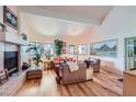 Bright living room boasts high ceilings, a fireplace, and wood floors at 2708 Campo Verde Dr, Las Vegas, NV 89121