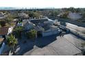 Expansive home features solar panels, three car garage, mature landscaping, and paved driveway at 2890 Belcastro St, Las Vegas, NV 89117