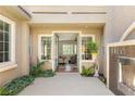 Inviting home entrance featuring a waterfall, lush greenery, and a glimpse into the living room at 3535 Coventry Gardens Dr, Las Vegas, NV 89135