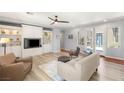 Comfortable living room featuring built-in shelving and ample seating at 3535 Coventry Gardens Dr, Las Vegas, NV 89135