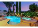 Inviting backyard pool with a spa, mature landscaping, and a serene atmosphere at 3535 Coventry Gardens Dr, Las Vegas, NV 89135