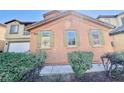 Charming two-story home with green shuttered windows and privacy landscaping at 3542 Harbor Tides St, Las Vegas, NV 89147