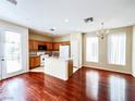 Open-concept kitchen and dining area with granite countertops and stainless steel appliances at 3542 Harbor Tides St, Las Vegas, NV 89147
