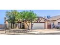 Charming single-story home featuring a two-car garage and low maintenance landscaping in a sunny neighborhood at 504 Arthur Ave, Henderson, NV 89015