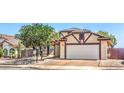 Charming single-story home featuring a two-car garage and low maintenance landscaping in a sunny neighborhood at 504 Arthur Ave, Henderson, NV 89015