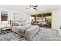 Serene main bedroom features a sliding door to a private balcony and stylish decor at 767 Tallgrass St, Las Vegas, NV 89138