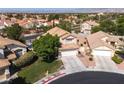 An aerial view of a home featuring a tiled roof in a suburban neighborhood at 7837 Fort Ruby Pl, Las Vegas, NV 89128