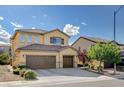 Inviting two-story home boasting a three-car garage, tile roof and easy care landscaping at 1127 Lake Berryessa St, Henderson, NV 89002