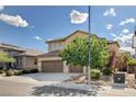 Two-story home featuring a three-car garage and well-manicured landscaping at 1127 Lake Berryessa St, Henderson, NV 89002
