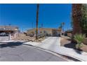 Charming single-story home with a long driveway, mature landscaping, and a well-maintained front yard at 1312 Denarius Cir, Las Vegas, NV 89101