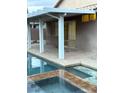Backyard pool with a shaded patio area, offering a refreshing escape and a relaxing outdoor living space at 1367 Sun Pillars Ave, Henderson, NV 89014