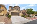 Two-story home featuring a two car garage, neutral color palette, and low maintenance landscaping at 190 Tall Ruff Dr, Las Vegas, NV 89148