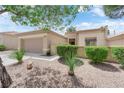 Attractive single-story home with a two-car garage and easy-care desert landscaping at 2323 Barbers Point Pl, Las Vegas, NV 89134