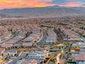 Panoramic aerial view showcases a meticulously planned community nestled against mountains and desert terrain at 365 Crown Mesa Ave, Las Vegas, NV 89138