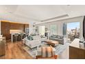 An open-concept living room with modern kitchen and seating at 3750 Las Vegas Blvd # 3006, Las Vegas, NV 89158