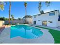 Inviting backyard featuring a large pool, perfect for relaxation and entertainment at 4046 Bridgeview Cir, Las Vegas, NV 89147