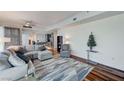 Comfortable living room adjacent to kitchen area, featuring modern decor and hardwood floors at 4525 Dean Martin Dr # 1208, Las Vegas, NV 89103