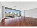 Bright and spacious living room with hardwood floors and large windows offering city views at 4575 Dean Martin Dr # 304, Las Vegas, NV 89103