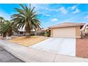 Charming single-story home with desert landscaping and a spacious two-car garage at 4719 Sparta Way, North Las Vegas, NV 89032