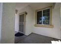 Inviting front porch with decorative features and a secure screen door entrance at 7089 Oberling Bay Ave, Las Vegas, NV 89113