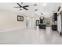 Open-concept living space featuring recessed lighting, stylish fixtures and seamless flow to the kitchen at 8021 Yellow Daisy Ave, Las Vegas, NV 89147