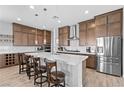 Spacious kitchen with stainless steel appliances, a large island, and lots of cabinet space at 8668 Hartmont St, Las Vegas, NV 89166