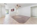 Bright living room boasts tile flooring, fresh white paint, and ample natural light at 8872 Perfect Diamond Ct, Las Vegas, NV 89129
