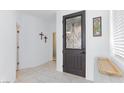Foyer with decorative glass front door and views into other rooms at 9112 Vista Greens Way # 204, Las Vegas, NV 89134