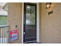 Stylish front door with decorative glass insert and a welcoming 'Welcome' sign at 9112 Vista Greens Way # 204, Las Vegas, NV 89134