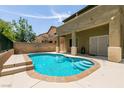 Private backyard pool has steps for entry, perfect for relaxation and entertaining at 9712 Red Horse St, Las Vegas, NV 89143