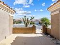 Inviting courtyard featuring a brick wall, desert landscaping, and neighborhood views at 10417 Sea Palms Ave, Las Vegas, NV 89134