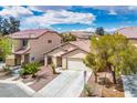 Beautiful home offers a spacious driveway and desert-friendly landscaping at 11091 Parete Ct, Las Vegas, NV 89141
