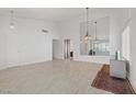 Open concept living room featuring tile flooring and pendant lights at 1219 Heather Oaks Way, North Las Vegas, NV 89031