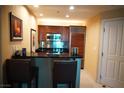 Cozy kitchenette area featuring sleek black counters and stainless steel appliances at 145 E Harmon Ave # 27621, Las Vegas, NV 89109