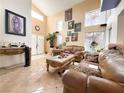 Spacious living room with tile flooring, high ceilings, and stylish decor at 1515 Fort Dix Cir, North Las Vegas, NV 89031