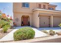 Inviting front entrance featuring desert landscaping, a neutral colored exterior, and a covered porch at 1699 Sonoran Bluff Ave, Henderson, NV 89014