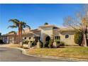 Single-story home featuring desert landscaping and a stone-accented entryway at 2111 Bogart Ct, Las Vegas, NV 89117