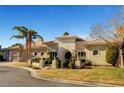 Single-story home featuring desert landscaping and a stone-accented entryway at 2111 Bogart Ct, Las Vegas, NV 89117