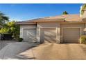 Spacious three car garage with neutral doors on a home with a private driveway at 2111 Bogart Ct, Las Vegas, NV 89117