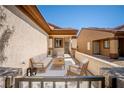 Inviting patio area with comfortable seating, perfect for relaxing outdoors and entertaining guests at 2708 Cheer Pheasant Ave, North Las Vegas, NV 89084