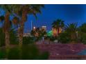 Stunning city view at dusk, framed by palm trees and rooftops at 3412 Crystal Tower St, Las Vegas, NV 89129
