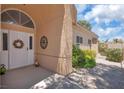 Inviting front entrance featuring a decorative door and charming accents at 471 Fallwood Ln, Las Vegas, NV 89107