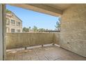 Open-air balcony with a sturdy railing and tiled floor, offering an outdoor space at 4718 Nara Vista Way # 104, Las Vegas, NV 89103