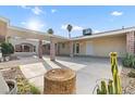 Large covered patio with brick columns offers ample space for outdoor living and entertaining at 4805 Jay Ave, Las Vegas, NV 89130